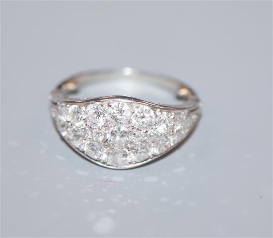 A white metal and diamond cluster set elliptical shaped ring, size H/I.